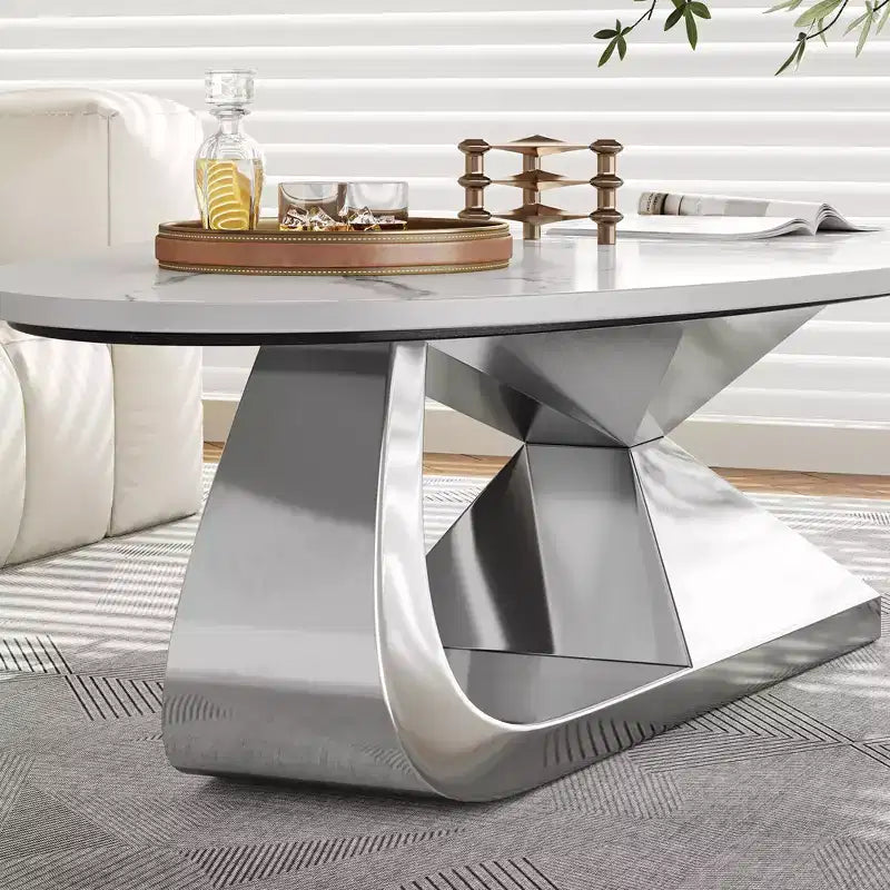 Tavolino con piano in ceramica e base contemporanea in acciaio inox, un elemento d'arredo durevole ed elegante per il soggiorno