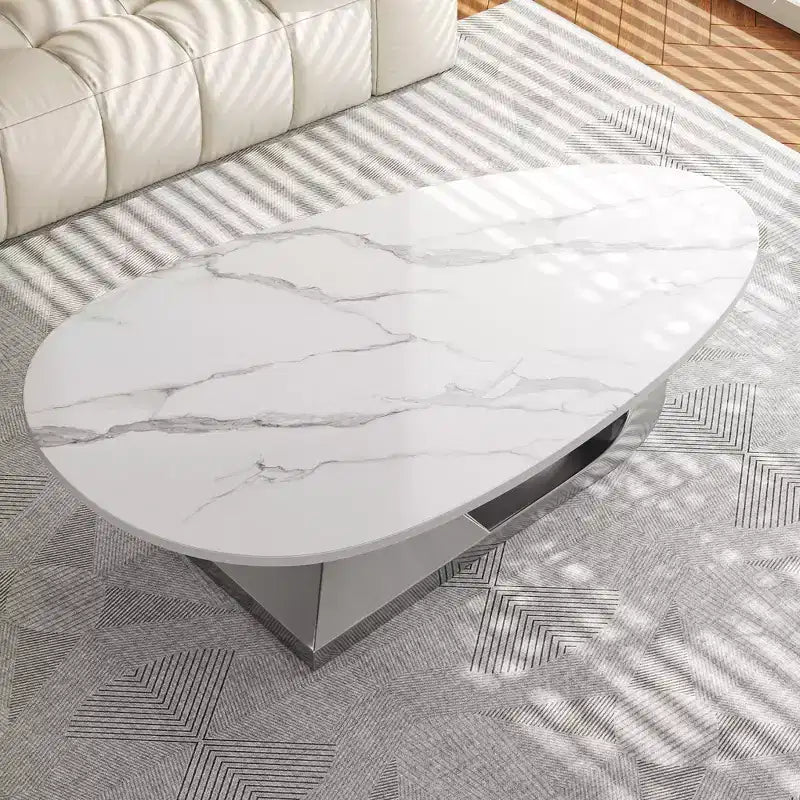 Tavolino con piano in ceramica e base contemporanea in acciaio inox, un elemento d'arredo durevole ed elegante per il soggiorno